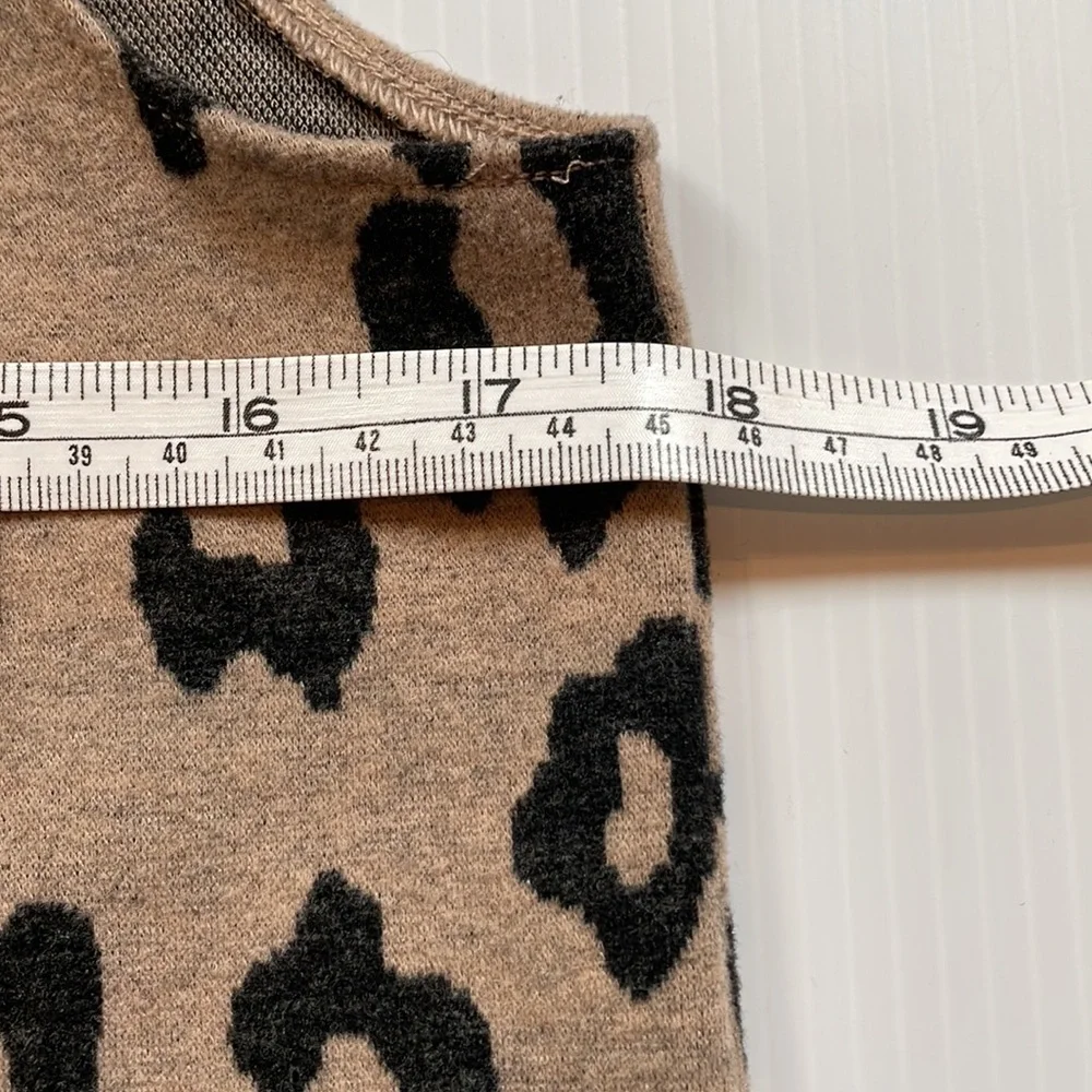 Cheetah print, tan & brown faux fur collared vest.  Girls size large + plus